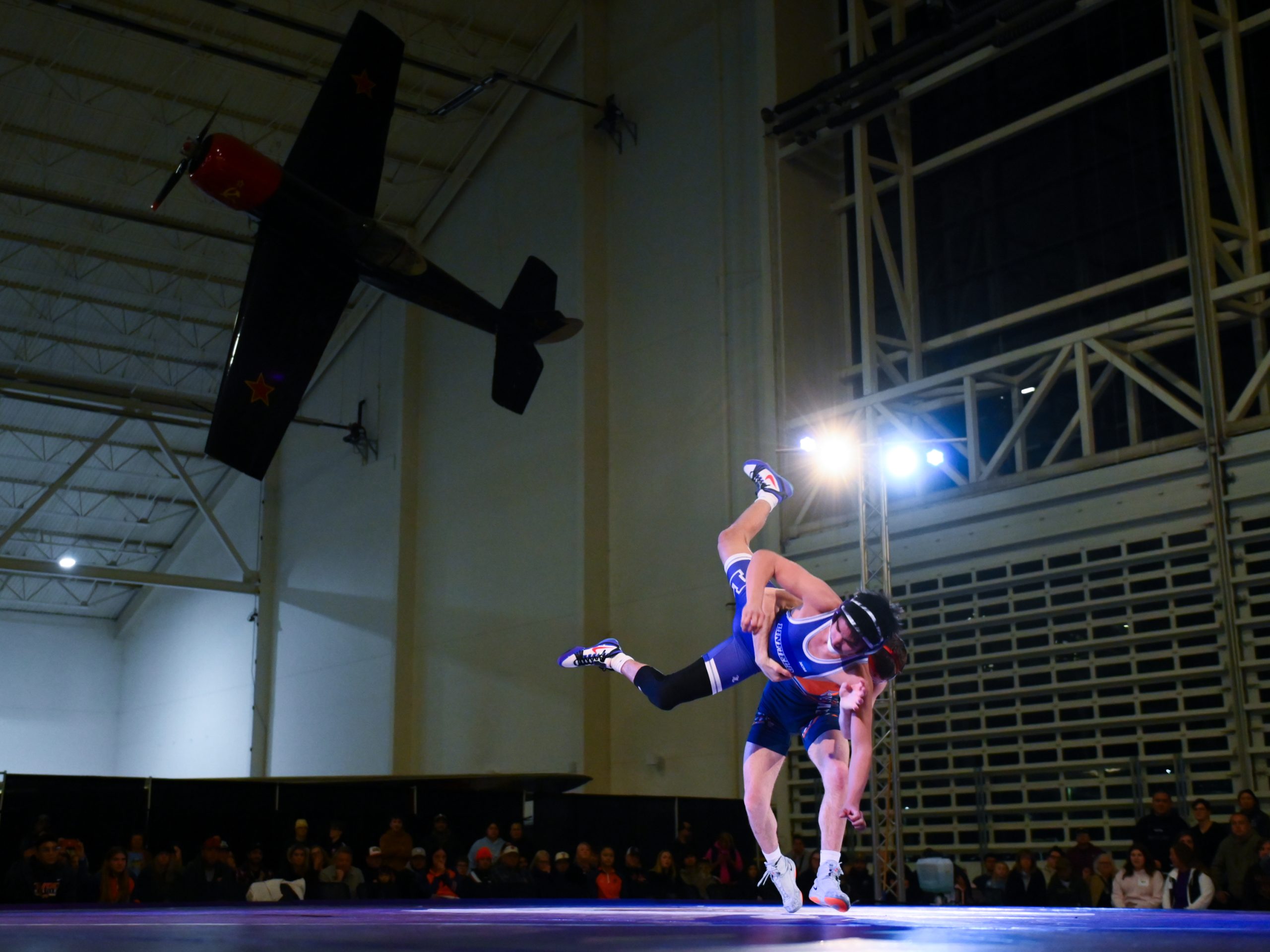 College wrestling’s surreal night at the airplane museum: I mean, why not?